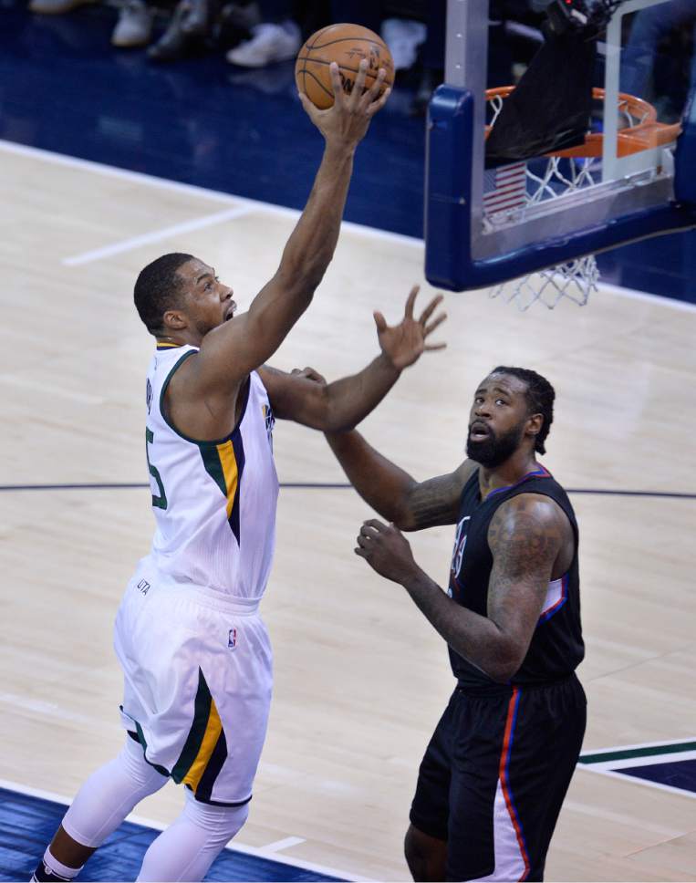 Scott Sommerdorf | The Salt Lake Tribune
Utah Jazz forward Derrick Favors (15) scores over LA Clippers center DeAndre Jordan (6) during first quarter play. The Utah Jazz trailed the LA Clipper 26-24 at the end of the first period of Game 4 of the Western Conference playoffs, Sunday, April 23, 2017.