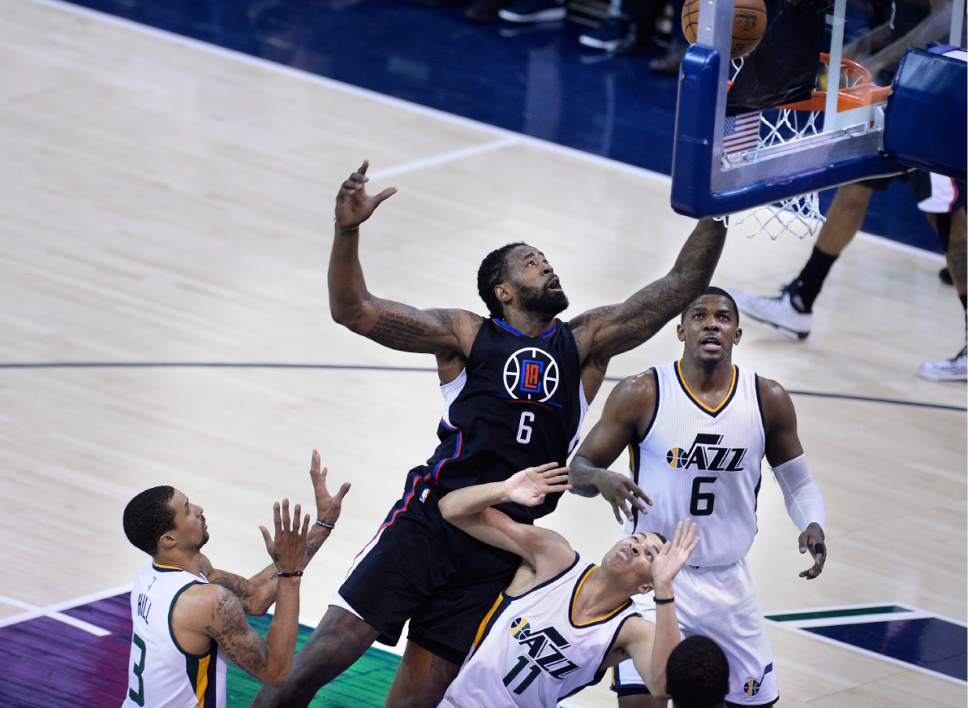 Scott Sommerdorf | The Salt Lake Tribune
LA Clippers center DeAndre Jordan (6) drives to the hoop over Utah Jazz guard Dante Exum (11) during second half play. The Utah Jazz beat the LA Clipper 105-98 to take Game 4 and tie up the Western Conference playoff series at 2-2, Sunday, April 23, 2017.