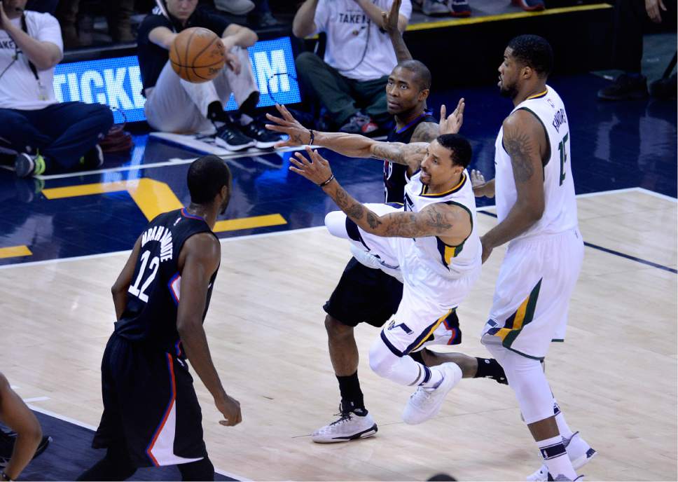Scott Sommerdorf | The Salt Lake Tribune
Utah Jazz guard George Hill (3) makes an awkward pass while losing his balance during second half play. The Utah Jazz beat the LA Clipper 105-98 to take Game 4 and tie up the Western Conference playoff series at 2-2, Sunday, April 23, 2017.
