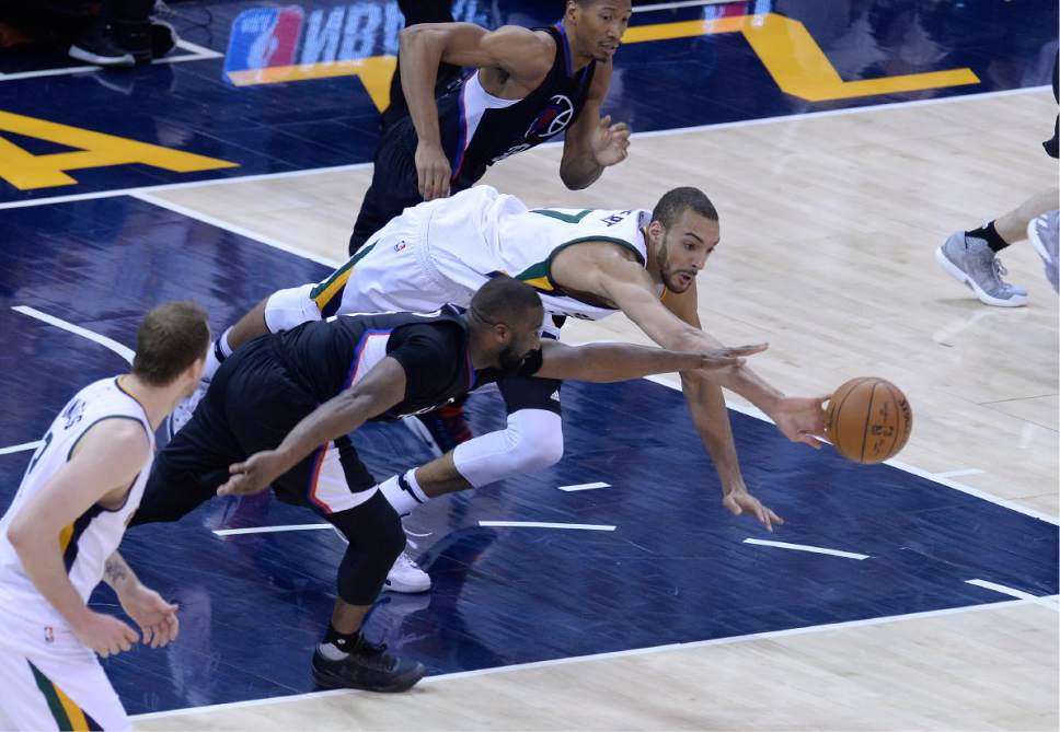 Scott Sommerdorf | The Salt Lake Tribune
Utah Jazz center Rudy Gobert (27) dives for a loose ball during second half play. The Utah Jazz beat the LA Clipper 105-98 to take Game 4 and tie up the Western Conference playoff series at 2-2, Sunday, April 23, 2017.