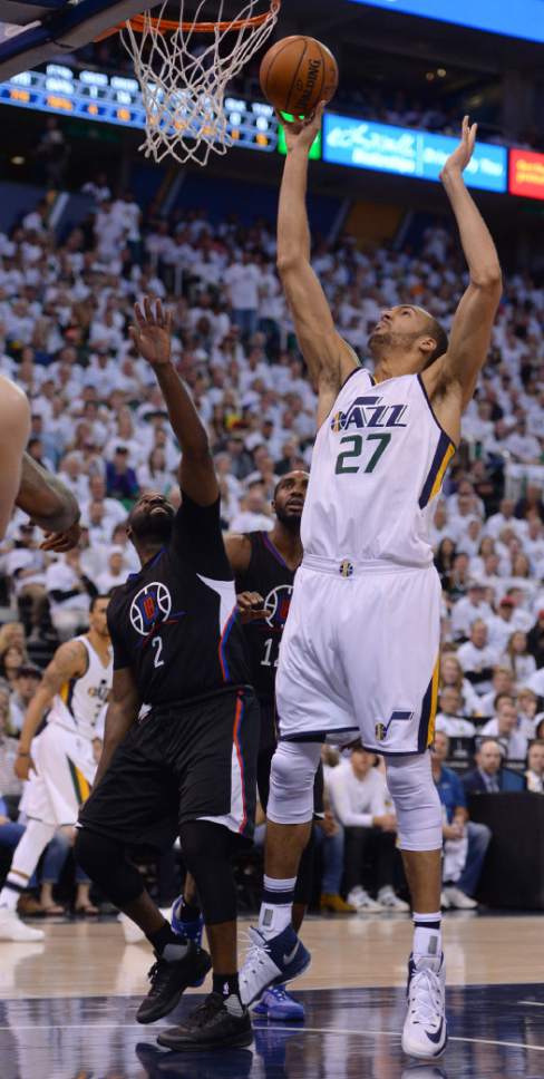 Steve Griffin  |  The Salt Lake Tribune


Utah Jazz center Rudy Gobert (27) taps in a shot over LA Clippers guard Raymond Felton (2) during the Jazz versus Clippers NBA playoff game at Viviint Smart Home arena in Salt Lake City Sunday April 23, 2017.