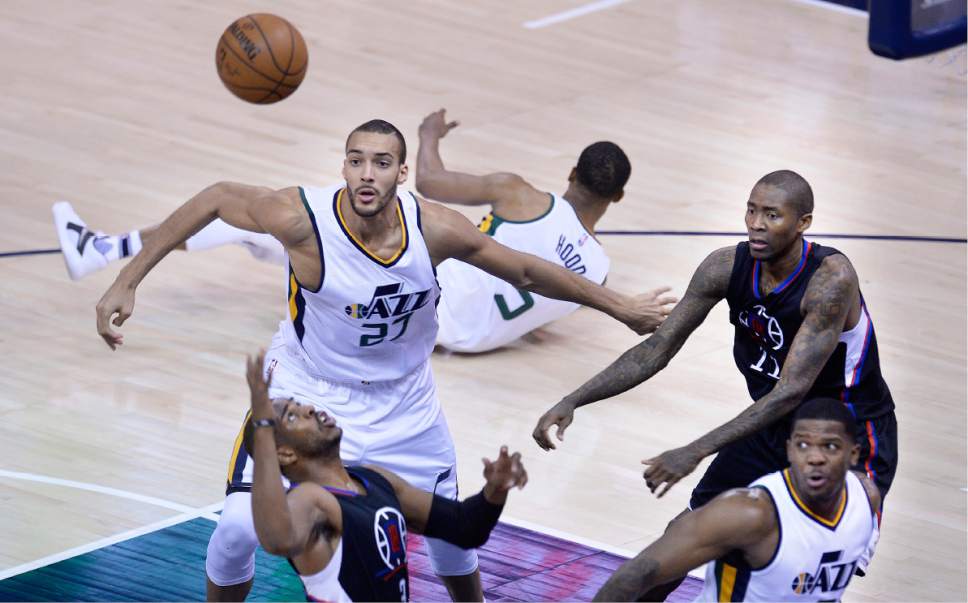 Scott Sommerdorf | The Salt Lake Tribune
Utah Jazz center Rudy Gobert (27) looks to battle for a rebound against LA Clippers guard Chris Paul (3) and LA Clippers guard Jamal Crawford (11) during first quarter play. The Utah Jazz trailed the LA Clipper 26-24 at the end of the first period of Game 4 of the Western Conference playoffs, Sunday, April 23, 2017.