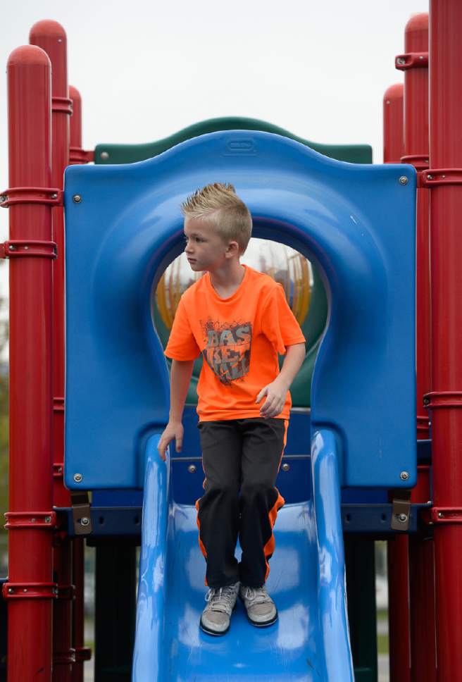 Francisco Kjolseth | The Salt Lake Tribune
Cole Johnson, 6, visits the playground at Woodrow Wilson Elementary in Salt Lake on Monday, April 24, 2017. Next week is National Playground Safety Week and the health department is looking to promote safe practices on playgrounds as they perform inspections.