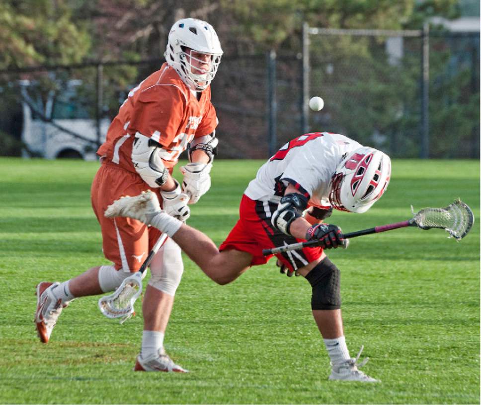 Michael Mangum  |  Special to the Tribune

Utah Utes freshman midfielder Noah Hill (28) has the ball knocked out of his pocket with pressure from Texas Longhorns junior face off specialist Thomas Loudermilk during their game at Ute Soccer Field in Salt Lake City on Thursday, April 13, 2017.
