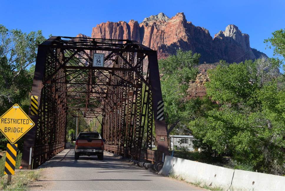 Scott Sommerdorf   |  The Salt Lake Tribune
The historic Rockville Bridge spans the Virgin River. The tiny town of Rockville will hold a fundraiser this week featuring an art sale to raise funds to preserve the bridge.