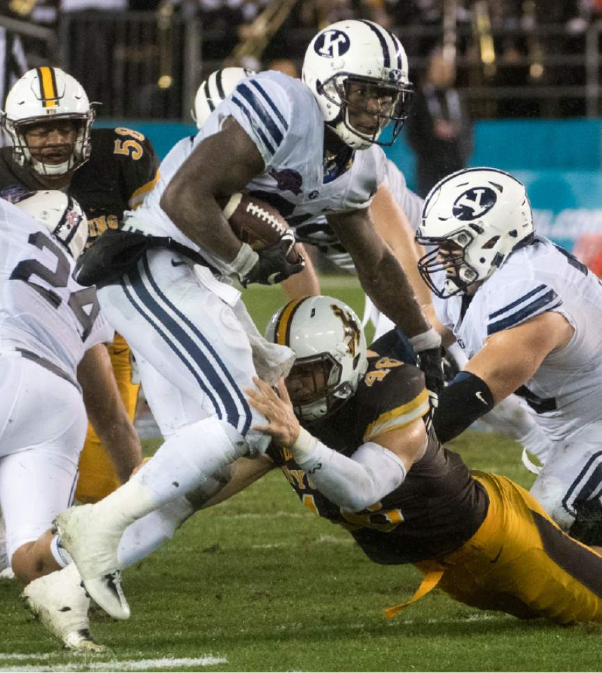 Rick Egan  |  The Salt Lake Tribune

Brigham Young Cougars running back Jamaal Williams (21) ran for 210 yards as BYU defeated the Wyoming Cowboys, 24-21, in the Poinsettia Bowl, at Qualcomm Stadium in San Diego, December 21, 2016.
