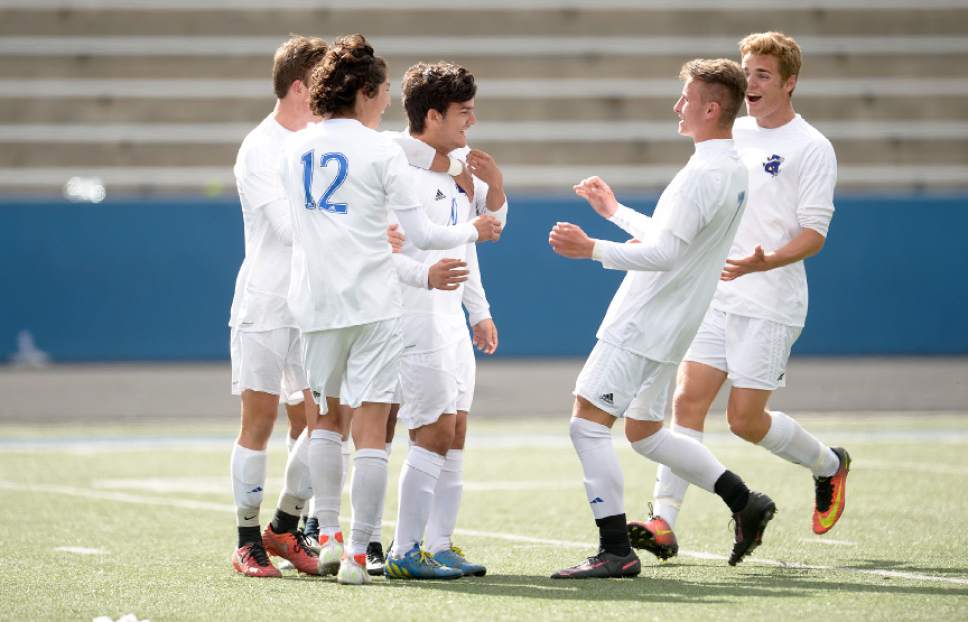 Leah Hogsten  |  The Salt Lake Tribune 
Bingham's Leo Sobreira celebrates his second of two game winning goals with teammates. Bingham High School boys' soccer team defeated Copper Hills High School 2-1, during their game April 25, 2017.