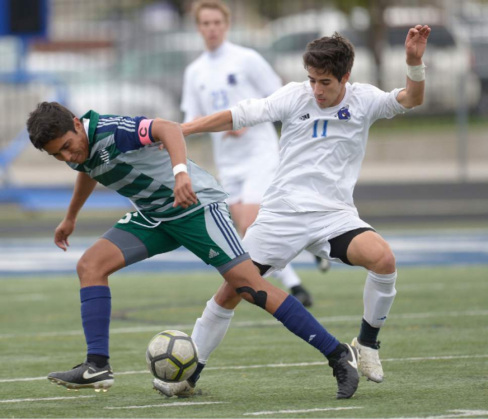 Leah Hogsten  |  The Salt Lake Tribune 
Copper Hills' Carlos Becerra-Gomez and Bingham's Tommy Merniez battle for possession. Bingham High School boys' soccer team defeated Copper Hills High School 2-1, during their game April 25, 2017.