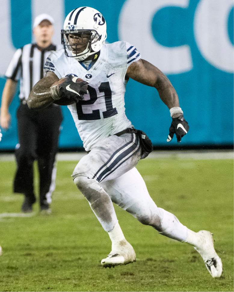 Rick Egan  |  The Salt Lake Tribune

Brigham Young running back Jamaal Williams (21) to run for a 36-yard touchdown for the Cougars, in the Poinsettia Bowl, at Qualcomm Stadium in San Diego, December 21, 2016.