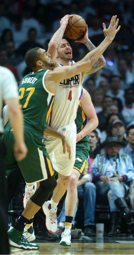 Steve Griffin  |  The Salt Lake Tribune


LA Clippers guard JJ Redick (4) gets trapped with the ball by Utah Jazz center Rudy Gobert (27) during game 5 of the the Jazz versus Clippers NBA playoff game at the Staples Center in Los Angeles Tuesday April 25, 2017.