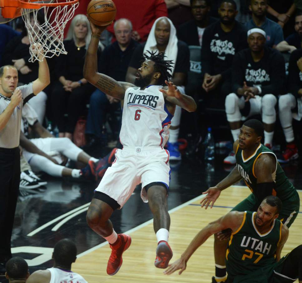 Steve Griffin  |  The Salt Lake Tribune


LA Clippers center DeAndre Jordan (6) hangs in the air and scores a basket after being fouled during game 5 of the the Jazz versus Clippers NBA playoff game at the Staples Center in Los Angeles Tuesday April 25, 2017.