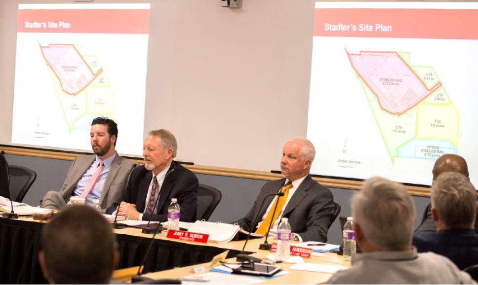 Leah Hogsten  |  The Salt Lake Tribune 
l-r Jayme Blakesley, Robert McKinley and UTA President and CEO, Jerry Benson discuss the Clearfield The Utah Transit Authority Board discussed  logistics of the controversial UTA Clearfield land deal during their open meeting, Wednesday, April 26, 2017.
