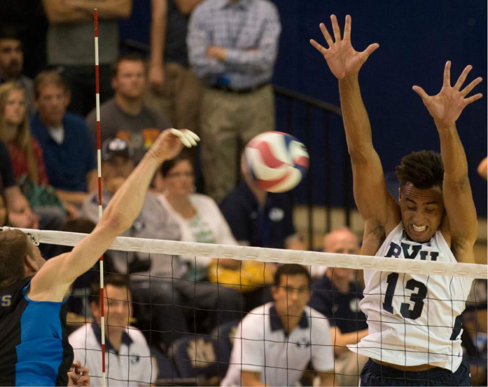 Rick Egan  |  The Salt Lake Tribune

UCLA Bruins JT Hatch (9) tries to get the ball past Brigham Young Cougars Ben Patch (13) in BYU's victory in the Mountain Pacific Sports Federation Volleyball Championship game,  in tournament action at the Smith Field House in Provo, Saturday, April 23, 2016.