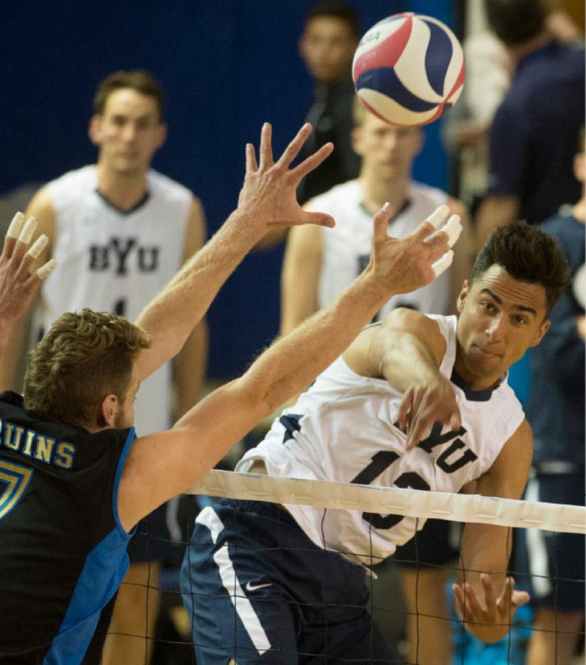 Rick Egan  |  The Salt Lake Tribune
Brigham Young Cougars Ben Patch (13) hits the ball past UCLA Bruins Mitch Stahl (7) in the Mountain Pacific Sports Federation Volleyball Championship game, as BYU beat UCLA 3- 1, in tournament action at the Smith Field House in Provo, Saturday, April 23, 2016.