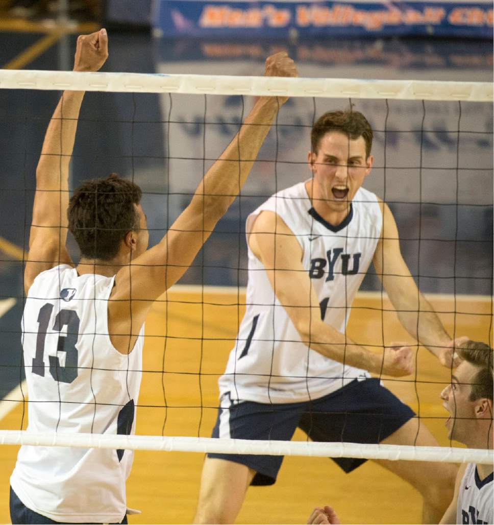 Rick Egan  |  The Salt Lake Tribune

Brigham Young Cougars Ben Patch (13) celebrates a score with Brigham Young Cougars Price Jarman (1), in BYU's victory in the Mountain Pacific Sports Federation Volleyball Championship game,  in tournament action at the Smith Field House in Provo, Saturday, April 23, 2016.