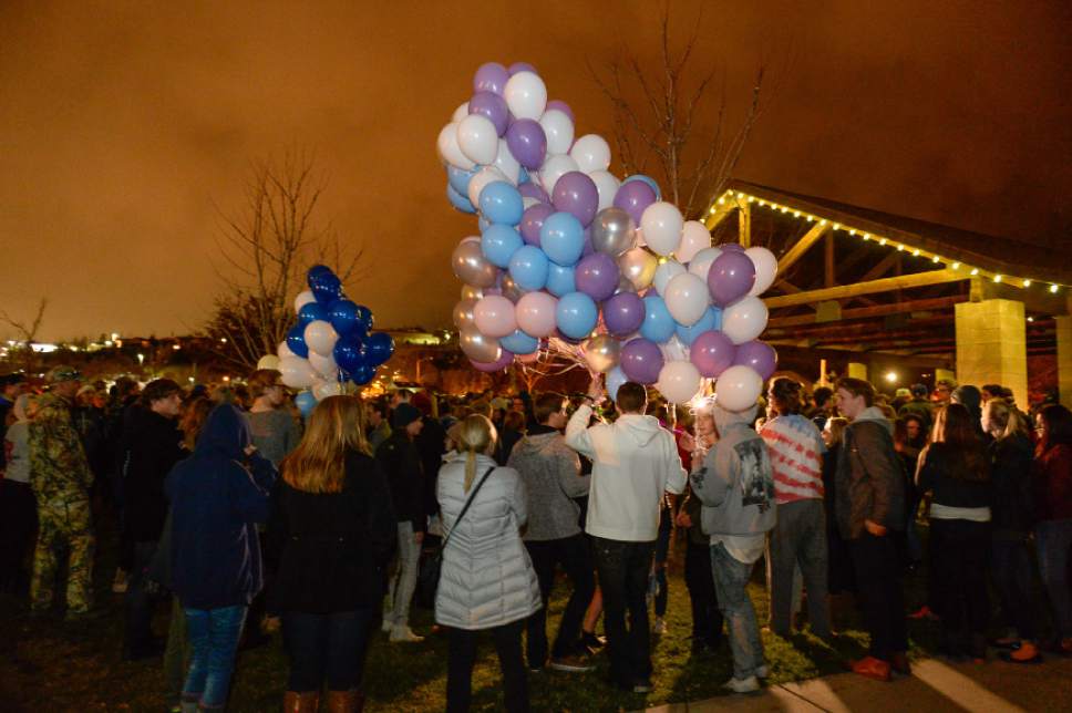 Francisco Kjolseth | The Salt Lake Tribune
Friends and family gather for a vigil at Draper City Park on Sunday evening, Nov. 20, 2016, in remembrance of teens Lexie Fenton and Ethan Fraga, both 16, who were killed in a car accident in Draper Saturday night. Balloons were passed around for people to write a note before releasing them into the cloud covered sky.