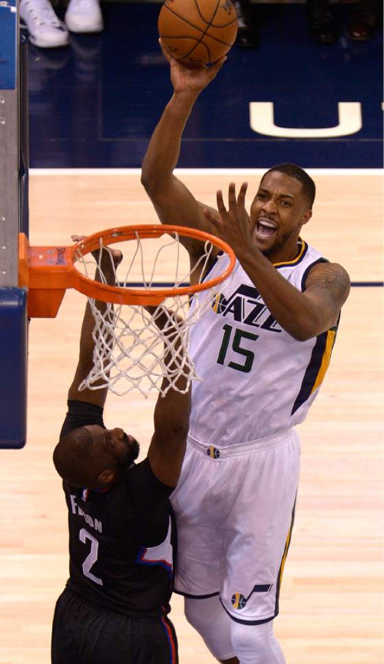 Leah Hogsten  |  The Salt Lake Tribune 
Utah Jazz forward Derrick Favors (15) hits the net over LA Clippers guard Raymond Felton (2). The Utah Jazz trail the Los Angeles Clippers 59-62 in the third quarter during Game 6 at Vivint Smart Home Arena, Friday, April 28, 2017 during the NBA's first-round playoff series.
