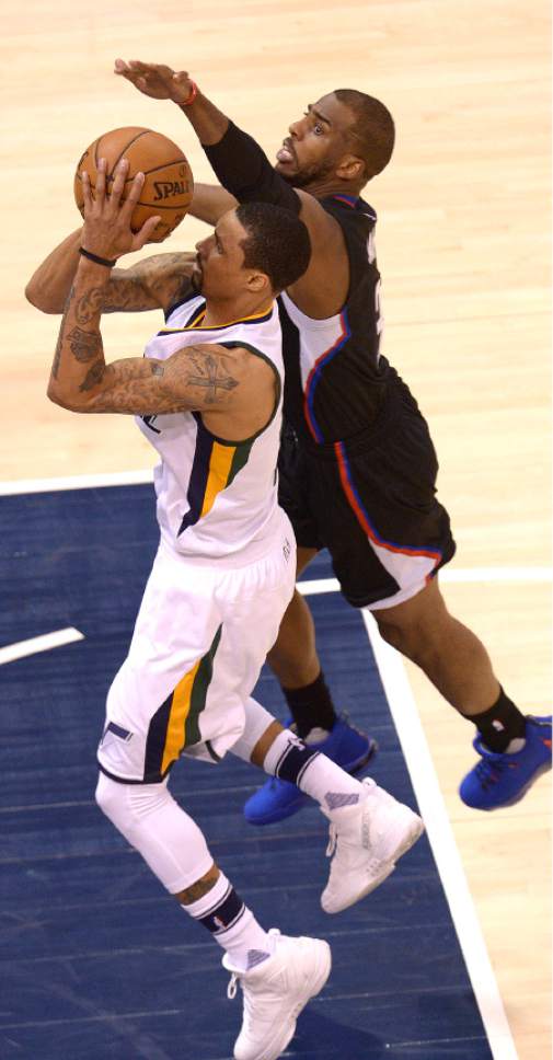 Leah Hogsten  |  The Salt Lake Tribune 
Utah Jazz guard George Hill (3) shoots past LA Clippers guard Chris Paul (3). The Utah Jazz trail the Los Angeles Clippers 59-62 in the third quarter during Game 6 at Vivint Smart Home Arena, Friday, April 28, 2017 during the NBA's first-round playoff series.