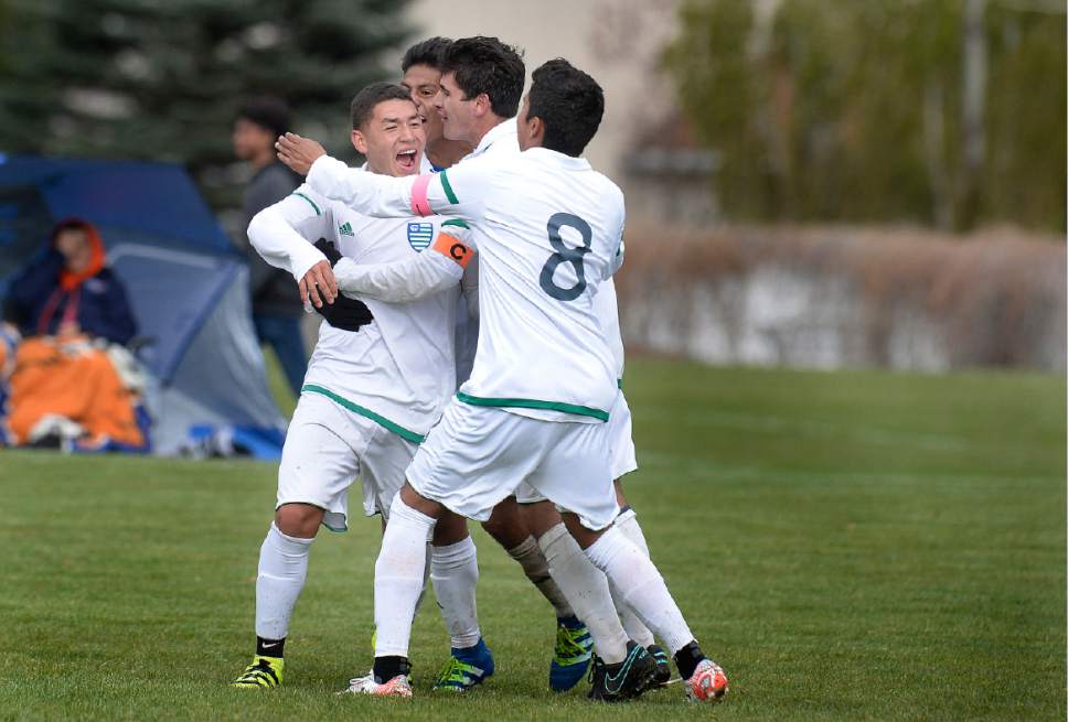 Scott Sommerdorf | The Salt Lake Tribune
Team mates mob Jonathan Castro, left, after his goal ended the game and Copper Hills defeated Brighton 4-3 in OT, Friday, April 28, 2017.