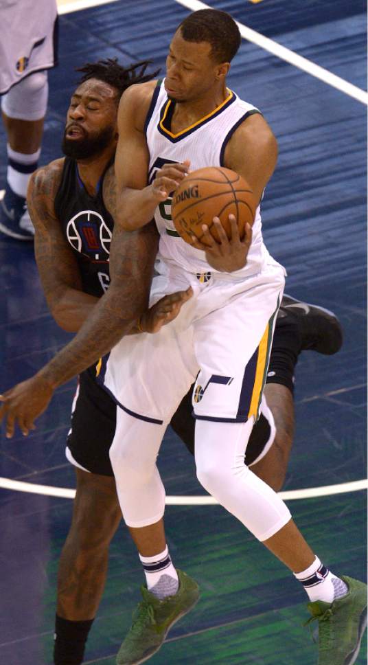 Leah Hogsten  |  The Salt Lake Tribune 
Utah Jazz guard Rodney Hood (5) collides with LA Clippers center DeAndre Jordan (6) pulling down the rebound. The Utah Jazz trail the Los Angeles Clippers 59-62 in the third quarter during Game 6 at Vivint Smart Home Arena, Friday, April 28, 2017 during the NBA's first-round playoff series.