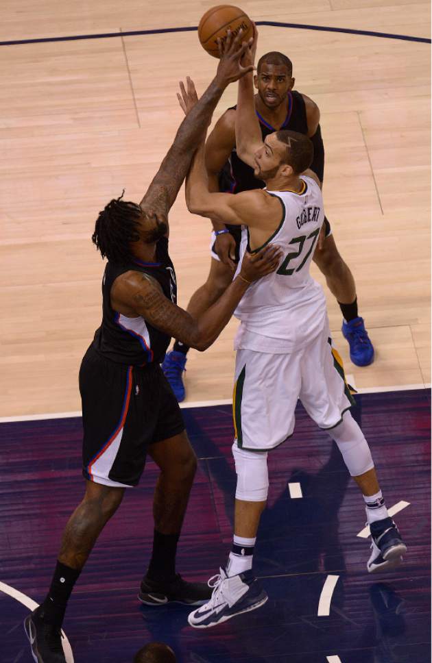 Leah Hogsten  |  The Salt Lake Tribune 
Utah Jazz center Rudy Gobert (27) looks for the pass over the defense of LA Clippers center DeAndre Jordan (6) and LA Clippers guard Chris Paul (3). The Utah Jazz trail the Los Angeles Clippers 59-62 in the third quarter during Game 6 at Vivint Smart Home Arena, Friday, April 28, 2017 during the NBA's first-round playoff series.