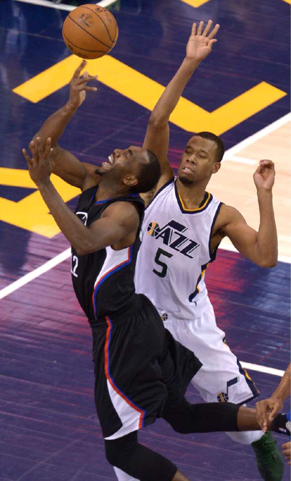 Leah Hogsten  |  The Salt Lake Tribune 
Utah Jazz guard Rodney Hood (5) fouls LA Clippers forward Luc Mbah a Moute (12) in the paint. The Utah Jazz fall to the Los Angeles Clippers 93-98 during Game 6 at Vivint Smart Home Arena, Friday, April 28, 2017 during the NBA's first-round playoff series.