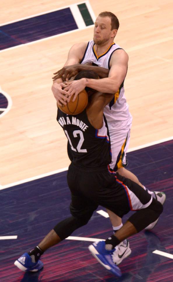 Leah Hogsten  |  The Salt Lake Tribune 
Utah Jazz forward Joe Ingles (2) fouls LA Clippers forward Luc Mbah a Moute (12). The Utah Jazz trail the Los Angeles Clippers 59-62 in the third quarter during Game 6 at Vivint Smart Home Arena, Friday, April 28, 2017 during the NBA's first-round playoff series.