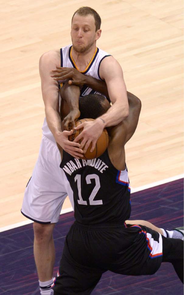 Leah Hogsten  |  The Salt Lake Tribune 
Utah Jazz forward Joe Ingles (2) fouls LA Clippers forward Luc Mbah a Moute (12). The Utah Jazz trail the Los Angeles Clippers 59-62 in the third quarter during Game 6 at Vivint Smart Home Arena, Friday, April 28, 2017 during the NBA's first-round playoff series.