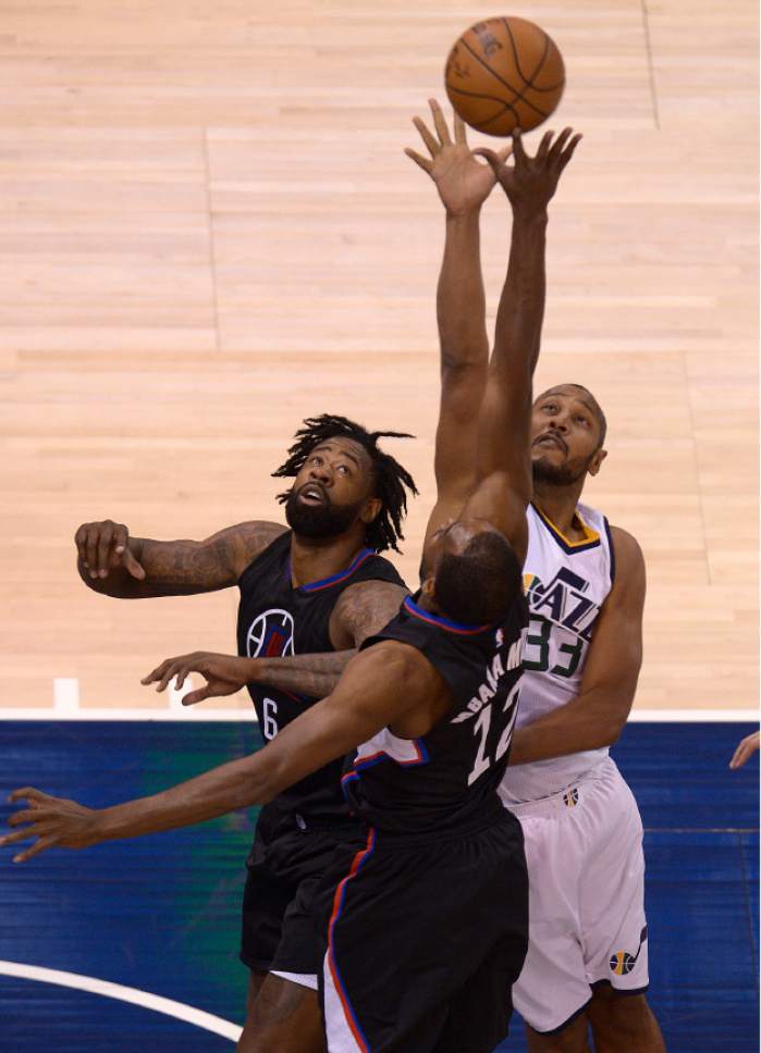 Leah Hogsten  |  The Salt Lake Tribune 
Utah Jazz center Boris Diaw (33) battles LA Clippers forward Luc Mbah a Moute (12) and LA Clippers center DeAndre Jordan (6) for possession. The Utah Jazz trail the Los Angeles Clippers 59-62 in the third quarter during Game 6 at Vivint Smart Home Arena, Friday, April 28, 2017 during the NBA's first-round playoff series.