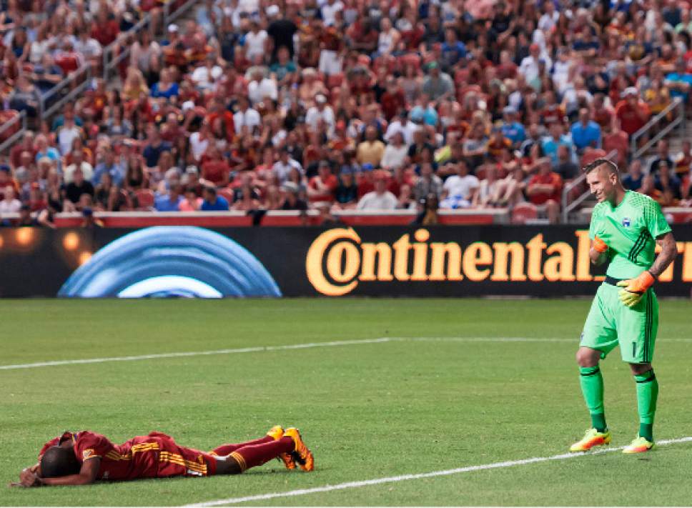 Michael Mangum  |  Special to the Tribune

Real Salt Lake defender Aaron Maund (21) lies on the ground after a collision as San Jose goalkeeper David Bingham (1) looks on during their MLS match at Rio Tinto Stadium in Sandy, Utah on Friday, July 22nd, 2016.