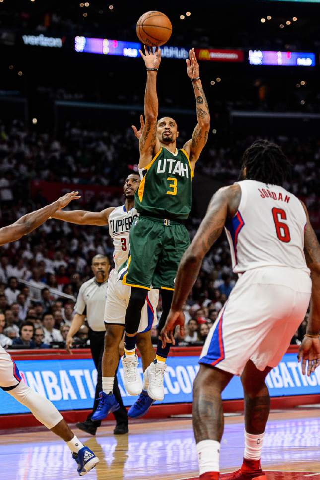Trent Nelson  |  The Salt Lake Tribune
Utah Jazz guard George Hill (3) puts up a shot ahead of LA Clippers guard Chris Paul (3) as the Utah Jazz face the Los Angeles Clippers in Game 7 at STAPLES Center in Los Angeles, California, Sunday April 30, 2017.