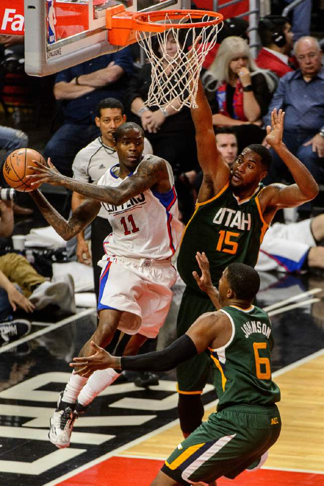 Trent Nelson  |  The Salt Lake Tribune
LA Clippers guard Jamal Crawford (11) looks to pass, defended by Utah Jazz forward Joe Johnson (6) and Utah Jazz forward Derrick Favors (15), as the Utah Jazz face the Los Angeles Clippers in Game 7 at STAPLES Center in Los Angeles, California, Sunday April 30, 2017.