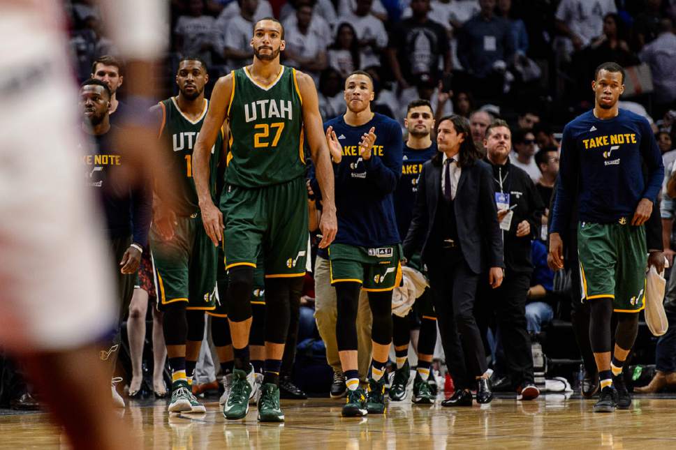 Trent Nelson  |  The Salt Lake Tribune
Utah Jazz forward Derrick Favors (15) and Utah Jazz center Rudy Gobert (27) walk onto the court to celebrate the win as the Utah Jazz face the Los Angeles Clippers in Game 7 at STAPLES Center in Los Angeles, California, Sunday April 30, 2017.