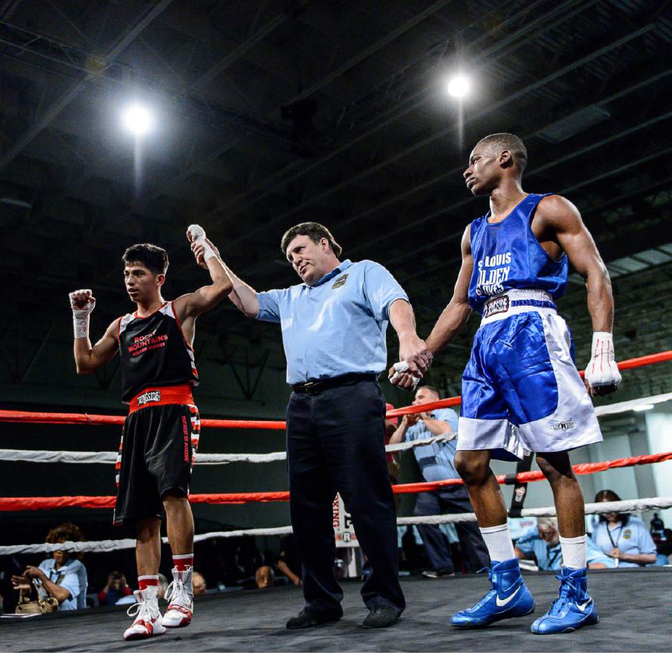 Trent Nelson  |  The Salt Lake Tribune
Diego Alvarez, Rocky Mountain (red), defeats Timothy Jarman, St. Louis, in boxing action at the Golden Gloves of America's 2016 National Tournament of Champions in Salt Lake City, Thursday May 19, 2016.