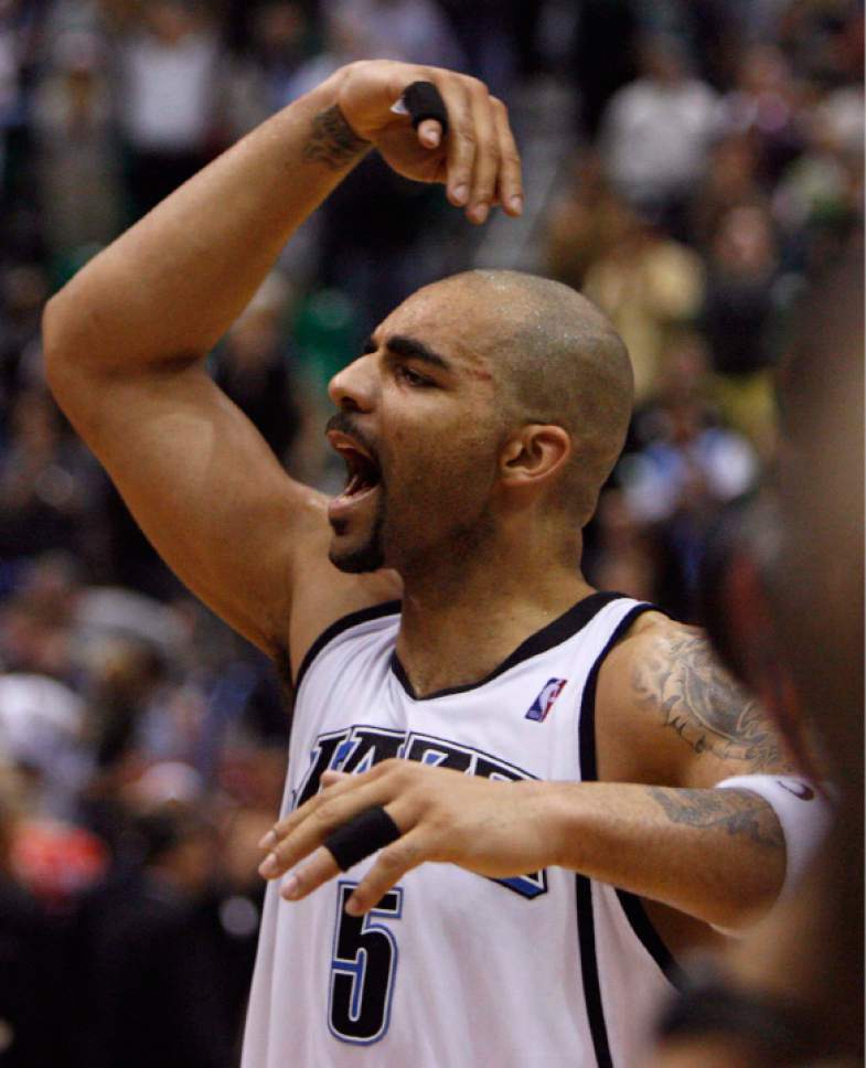 Trent Nelson  |  Tribune file photo


Utah Jazz forward Carlos Boozer (5) acknowledges the crowd as he walks off the court following the Jazz win. Utah Jazz vs. Houston Rockets, game 6, NBA playoffs first round.  Jazz win 94-82. May 3, 2007.