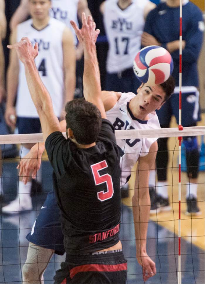 Rick Egan  |  The Salt Lake Tribune

Brenden Sander (15) BYU, hits the ball past Gabriel Vega (5) Stanford, in Volleyball action, BYU vs. Stanford, at the Smith Field House in Provo,  Saturday, April 15, 2017.