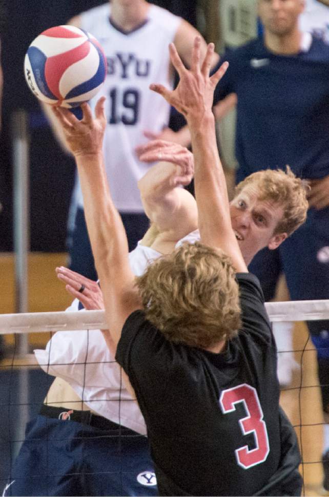 Rick Egan  |  The Salt Lake Tribune

Jake Langlois (10) BYU, tries to get the ball pastPaul Bischoff (3) Stanford, in Volleyball action, BYU vs. Stanford, at the Smith Field House in Provo,  Saturday, April 15, 2017.