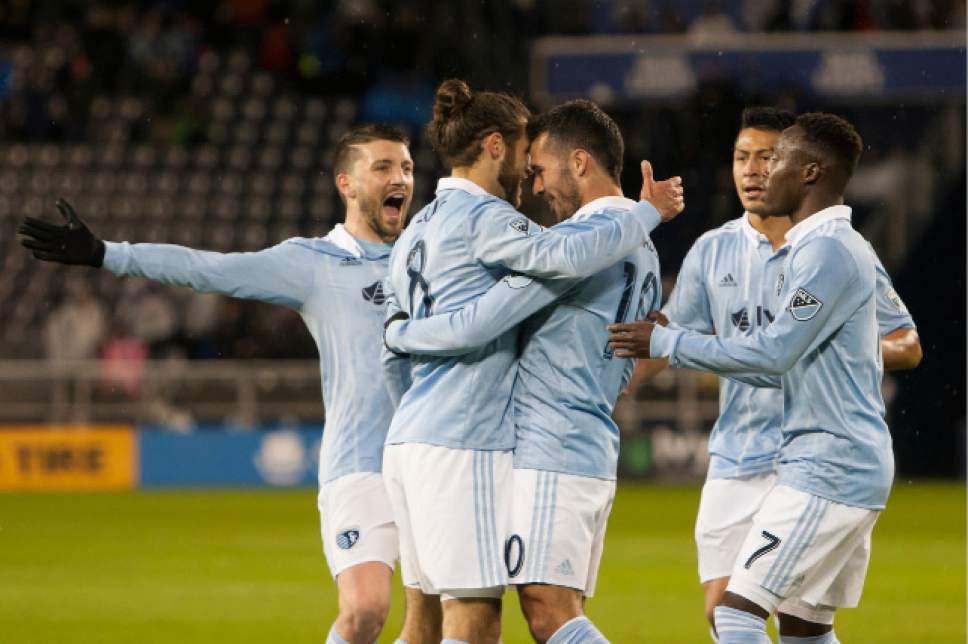 Sporting Kansas City midfielder Benny Feilhaber (10) and midfilder Graham Zusi (8) and teammates celebrate a goal against Real Salt Lake during the first half of an MLS soccer match Saturday, April 29, 2017, in Kansas City, Kan. (Nick Tre. Smith/The Kansas City Star via AP)/The Kansas City Star via AP)