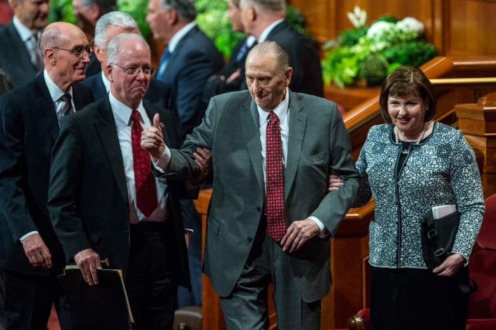 Chris Detrick  |  The Salt Lake Tribune
President Thomas S. Monson gives a thumbs up as he leaves with his daughter, Ann M. Dibb, after the morning session of the 187th Annual General Conference at the Conference Center on April 1 in Salt Lake City.