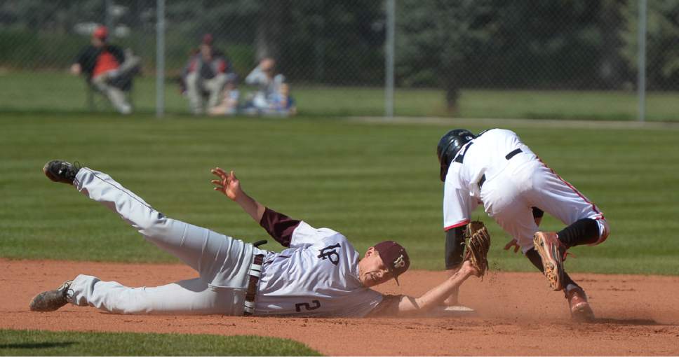 Francisco Kjolseth | The Salt Lake Tribune
American Fork's Brayden Howard manages to stay out of reach of Payton Barney of Lone Peak at second base during game action at American Fork on Tuesday, May 2, 2017.