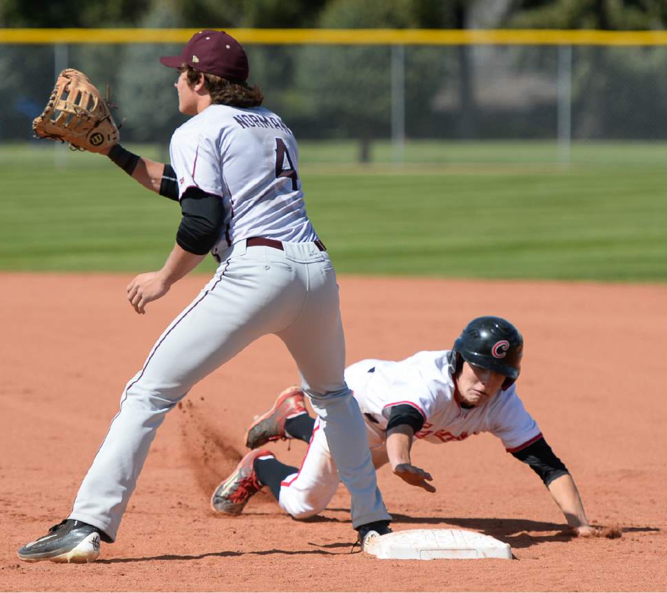 Francisco Kjolseth | The Salt Lake Tribune
American Fork's Brayden Howard manages to narrowly avoid an out by Eli Norman of Lone Peak after sliding safely back to first base during game action at American Fork on Tuesday, May 2, 2017.