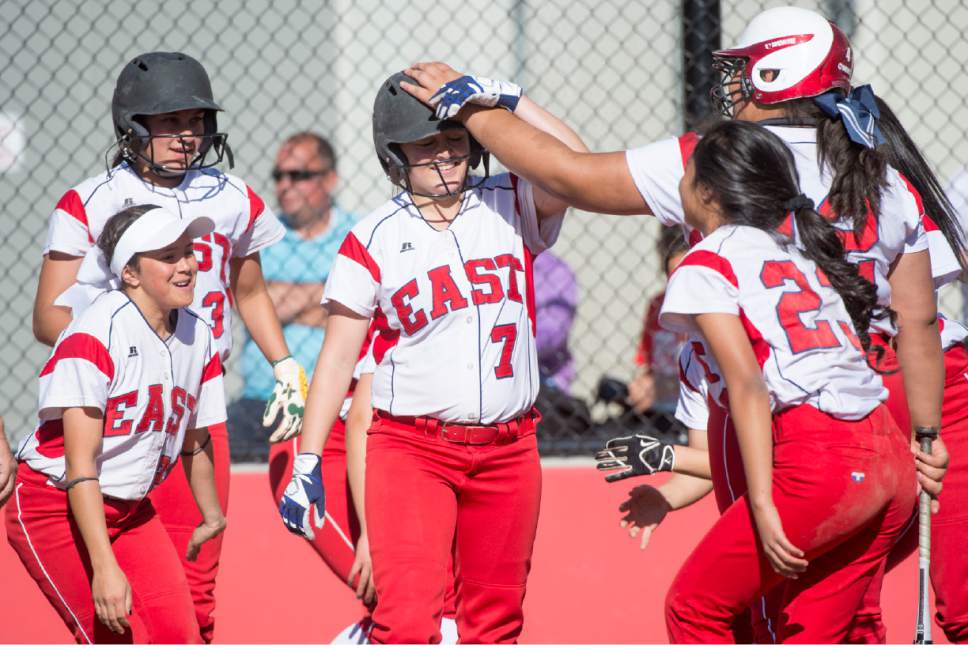 Rick Egan  |  The Salt Lake Tribune

East team mates  celebrate as Lexi Lokeni (7) crosses the plate after finally putting some runs on the board for East in the 6th inning. Box Elder defeated East 12-2  in prep softball action, in Salt Lake City, Monday, May 1, 2017.