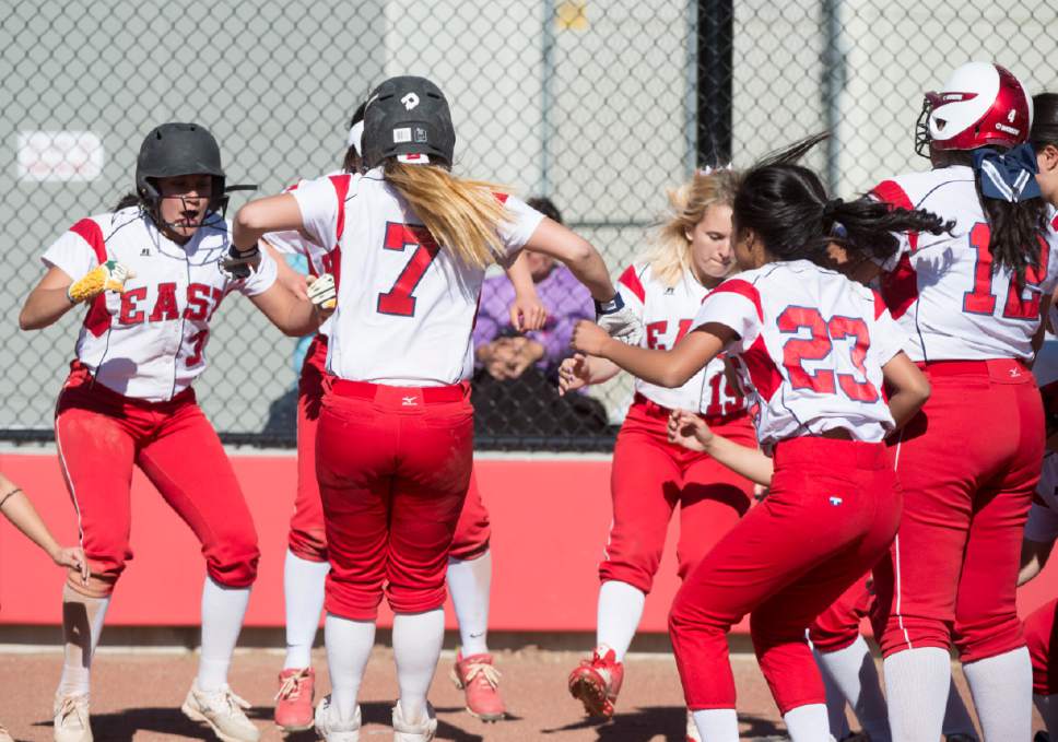 Rick Egan  |  The Salt Lake Tribune

East team mates  celebrate as Lexi Lokeni (7) crosses the plate after finally putting some runs on the board for East in the 6th inning. Box Elder defeated East 12-2  in prep softball action, in Salt Lake City, Monday, May 1, 2017.