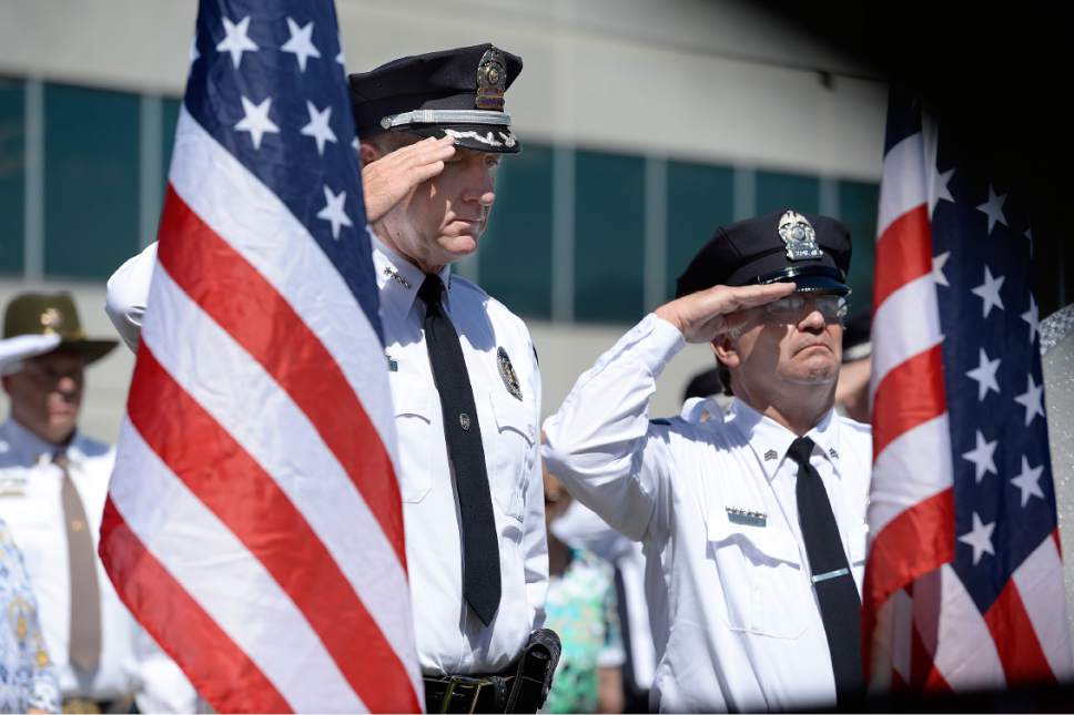 Scott Sommerdorf | The Salt Lake Tribune
Sheriff Jim Winder, center, and Sergeant Jeff Evans salute during the presentation of the wreath during the Salt Lake County Sheriff's Office's annual memorial service hosted by the Salt Lake County Sheriff's Office Mutual Aid Association, Wednesday, May 3, 2017.