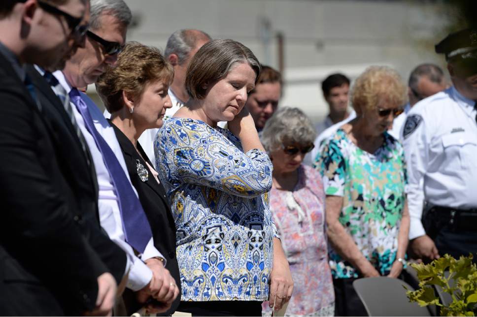 Scott Sommerdorf | The Salt Lake Tribune
Erika Barney, widow of Officer Doug Barney stands at the beginning of the Salt Lake County Sheriff's Office's annual memorial service hosted by the Salt Lake County Sheriff's Office Mutual Aid Association, Wednesday, May 3, 2017.