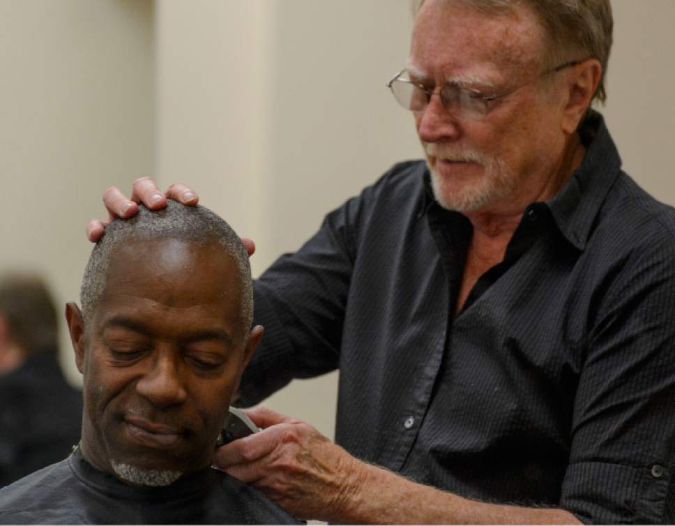 Steve Griffin  |  The Salt Lake Tribune
Stuart Stone gives Leanthony Edwards a hair cut at the Weigland Center in Salt Lake City earlier this month. Stone as been volunteering his services giving haircuts to homeless individuals for about 20 years.