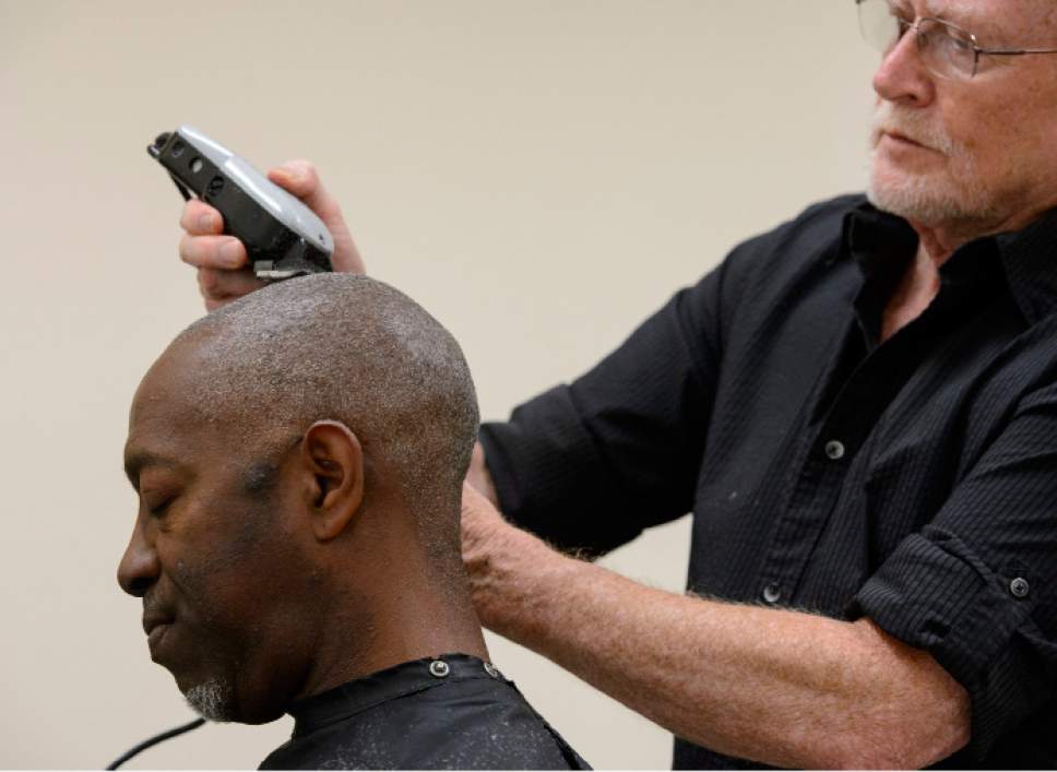 Steve Griffin  |  The Salt Lake Tribune


Stuart Stone gives Leanthony Edwards a hair cut at the Weigland Center in Salt Lake City Monday April 17, 2017. Stone as been volunteering his services giving haircuts to homeless individuals for some 20 years.