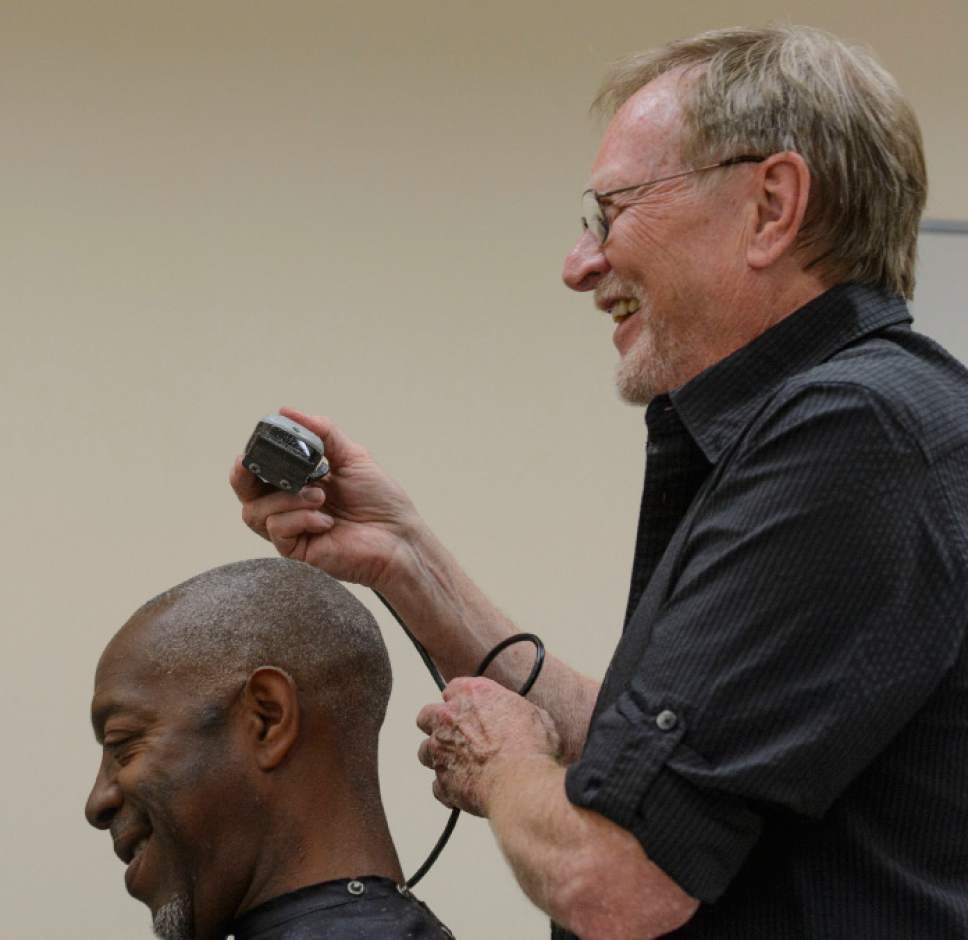 Steve Griffin  |  The Salt Lake Tribune


Stuart Stone laughs with Leanthony Edwards as he gives him a hair cut at the Weigland Center in Salt Lake City Monday April 17, 2017. Stone as been volunteering his services giving haircuts to homeless individuals for some 20 years.