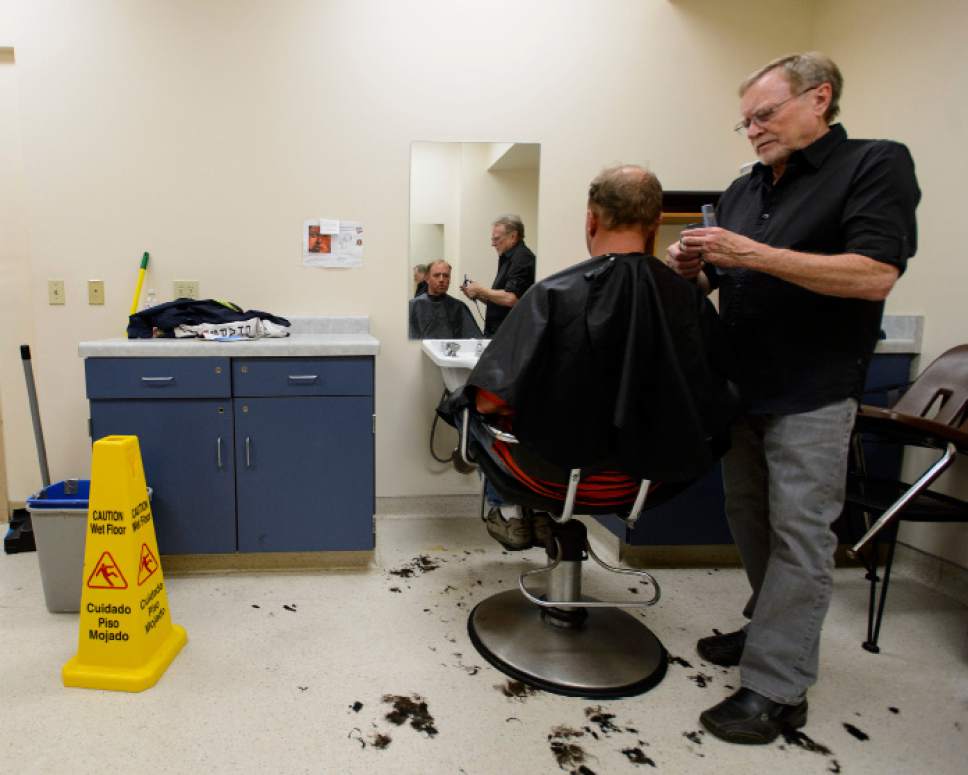 Steve Griffin  |  The Salt Lake Tribune


Stuart Stone cuts Brad Rubsam's hair at the Weigland Center in Salt Lake City Monday April 17, 2017. Stone as been volunteering his services giving haircuts to homeless individuals for some 20 years.