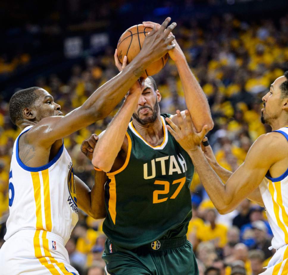 Steve Griffin  |  The Salt Lake Tribune


Utah Jazz center Rudy Gobert (27) splits the defense of Golden State Warriors forward Kevin Durant (35) and Golden State Warriors guard Shaun Livingston (34) during NBA playoff game between the Utah Jazz and the Golden State Warriors at Oracle Arena in Oakland Tuesday May 2, 2017.